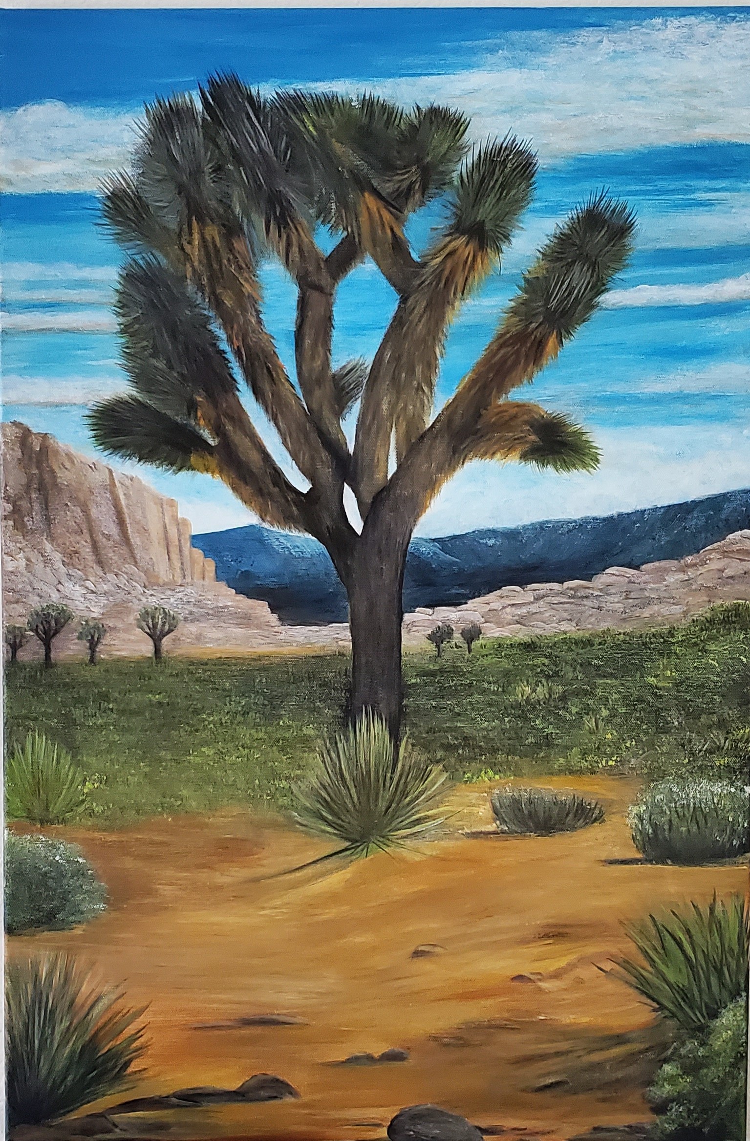 Acrylic painting of a Joshua tree in a Southwest desert landscape